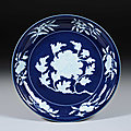 Dish, porcelain with design of peony spray in reserve against cobalt blue ground, ming dynasty, xuande mark and period (1426-143