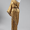 A Balenciaga gold ''Sari'' dress worn by Elizabeth Taylor at the premiere of the New Review Lido in Paris. Photo courtesy Kerry Taylor Auctions.