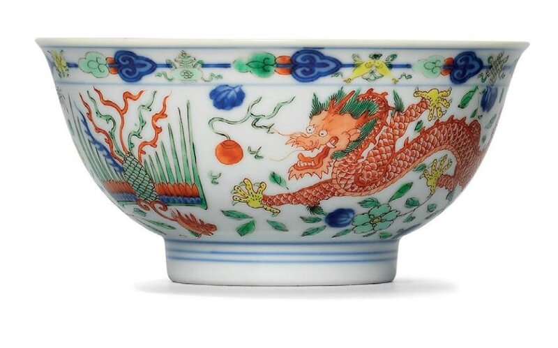 A fine pair of wucai ‘dragon and phoenix’ bowls, Qianlong six-character seal marks in underglaze blue and of the period (1736-1795)