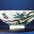 A fine doucai conical 'dragon' bowl, Yongzheng six-character mark within double-circles and of the period (1723-1735)