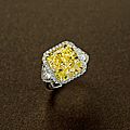 A 10.43 carat fancy vivid yellow diamond ring