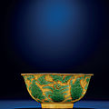 A rare late Ming yellow-ground green-enamelled incised 'Daoist figures' bowl, Jiajing six-character mark and of the period (1522-1566)