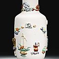 A moulded famille-rose ‘hundred antiques’ vase, qing dynasty, 18th century 