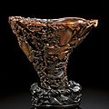 A rare and exceptionally carved rhinoceros horn libation cup, by bao tiancheng, 17th century