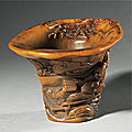 An exceptional inscribed rhinoceros horn 'drunken poet' libation cup, signed by You Kan (active 1660 - 1720), Qing dynasty, Kangxi period (1662-1722)