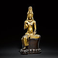 A highly important gilt-bronze seated figure of avalokiteshvara, acuoye guanyin, dali kingdom, 11th - 12th century