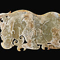 A rare archaic jade 'rhinoceros' plaque, eastern zhou dynasty (770-221 bc)