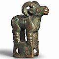 A bronze ram-form yoke ornament, circa 5th-4th century bc