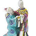 A famille rose group of a couple, qing dynasty, qianlong period (1736-1795)