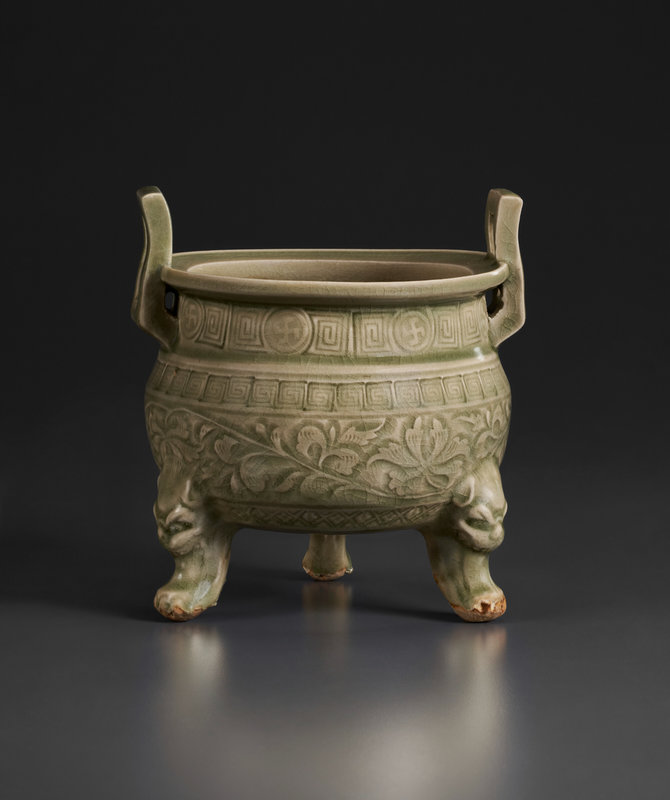 An unusual carved and molded Yaozhou celadon tripod censer, Northern Song-Jin dynasty, 12th century;