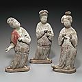 An unusual group of three painted pottery figures of court ladies, Tang dynasty (AD 618-907)