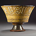 A rare mamluk sgraffito pottery bowl with lion of baybars, egypt, circa 1260-77 ad