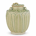 A rare small Yueyao 'lotus-bud' jar and cover, Five Dynasties (907-960)