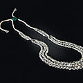 A diamond and emerald necklace