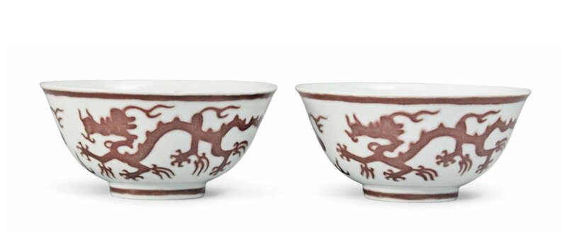 A pair of copper red-decorated ‘dragon’ bowls, Kangxi six-character marks in underglaze blue within a double circle and of the period (1662-1722)
