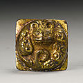 A gilt-bronze 'tiger' fitting, han dynasty (206 bc-220 ad)