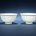 A pair of white-glazed anhua-decorated 'dragon' bowls, 18th century