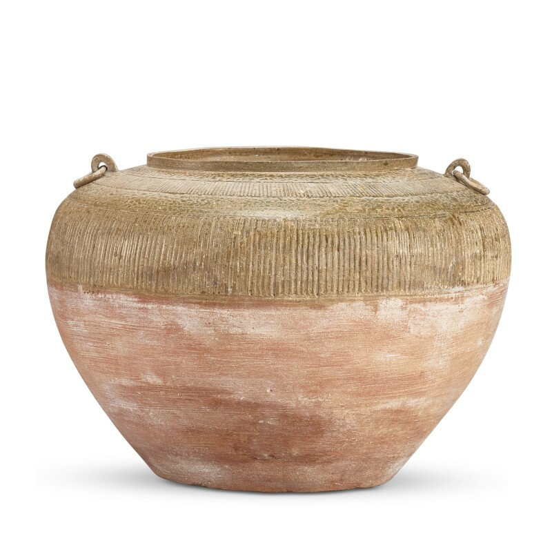 A celadon-glazed handled jar, Eastern Zhou dynasty, Warring States period