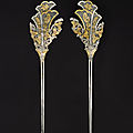 A rare pair of parcel-gilt silver 'floral' hairpins, tang dynasty (618-907)
