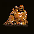 A carved boxwood seated buddha, qing dynasty, 18th century