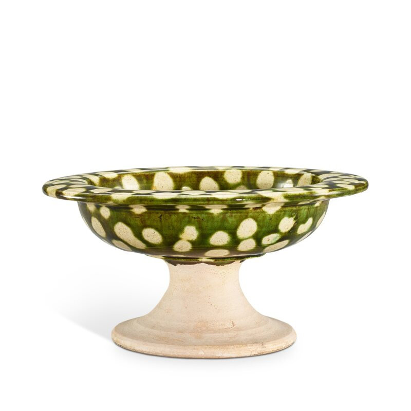 A green and cream-glazed stem bowl, Tang dynasty (618-907)