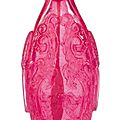 An archaistic ruby-red glass ‘kuilong' snuff bottle, Qing dynasty, 18th-19th century