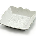 An inscribed moulded white-glazed square dish, song dynasty (960-1279)