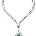 An emerald and diamond pendant necklace, by harry winston
