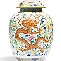 A 'famille-rose' 'dragon and phoenix' vase and cover, jiaqing seal mark and period