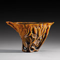 A carved rhinoceros horn libation cup, China, Qing dynasty, 17th century

