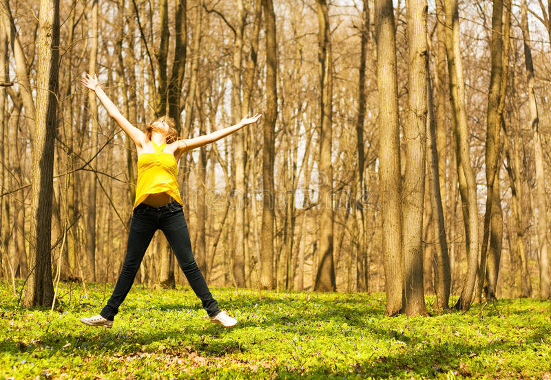 happy-woman-jumping-spring-nature-14163203