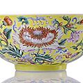 An extremely rare imperial 'famille rose' bowl with exotic flowers on a yellow ground. qianlong mark and period