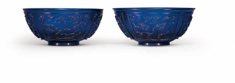 A pair of carved blue glass bowls, Qing dynasty, 19th century