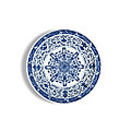 A large blue and white 'eight buddhist emblems' dish, mark and period of yongzheng