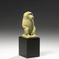 An egyptian green glazed composition statuette of a baboon. late period, 26th-30th dynasties, circa 664-332 b.c.