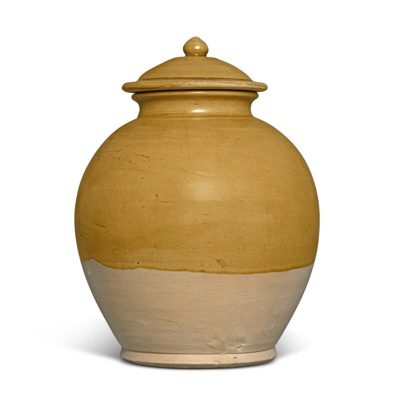 An amber-glazed pottery jar and cover, Tang dynasty