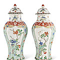 A pair of famille verte octagonal vases and covers, kangxi period (1662-1722)