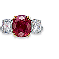 A three-stone ruby and diamond ring