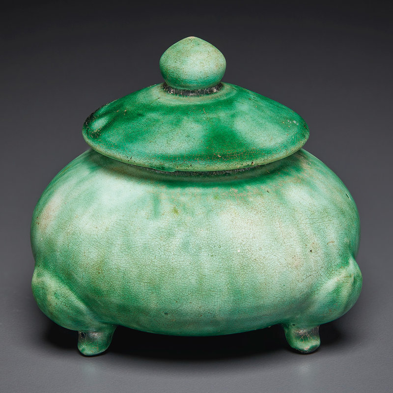 A small green-glazed tripod jar and cover, Tang dynasty (AD 618-907)