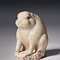 A small white-glazed stoneware figure of a rabbit, tang dynasty (ad 618-907)