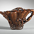 A carved rhinoceros horn 'chilong' libation cup, China, Qing Dynasty, 17th century