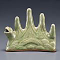 A longquan celadon mountain-form brush rest and water dropper, ming dynasty (1368-1644)