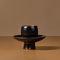 A small black-glazed, cup stand, song dynasty (960-1279)