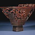 A finely carved archaistic rhinoceros horn libation cup. 17th century
