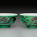 A pair of aubergine and green-glazed 'dragon' bowls, kangxi marks and period (1662-1722)