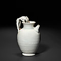 A rare small glazed white ware lion-handled ewer, Tang dynasty, 9th-10th century