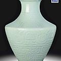 A magnificent celadon-glazed carved baluster vase, qianlong seal mark in underglaze blue and of the period (1736-1795)