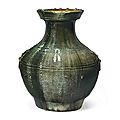 A dark green-glazed red pottery jar, hu, china, han dynasty (206 bc-ad 220)