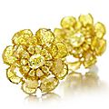 A pair of yellow diamond ear clips by viren bhagat