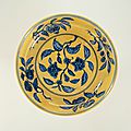 Dish with flower branches in blue on a yellow ground, Zhengde mark and period (1506 – 1521)